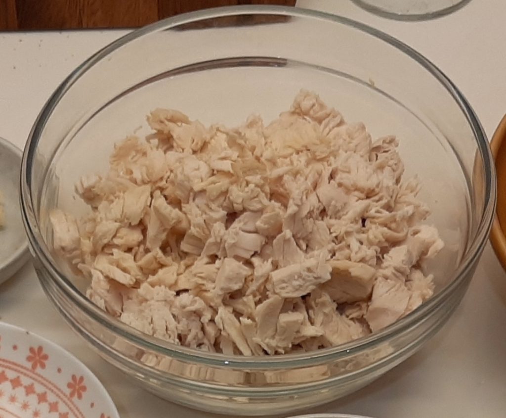 When it is cooled down keep the stock apart and shred the chicken.