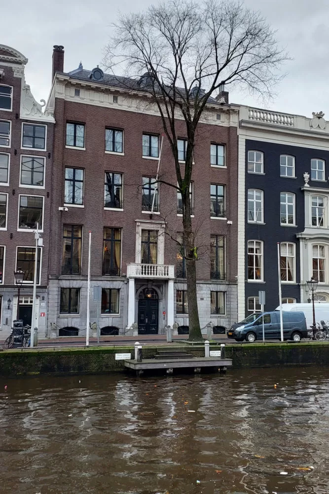 Explore the Canals of Amsterdam Tour by Foot. The house with the columns.