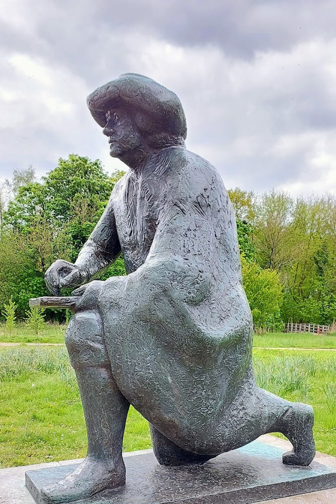 Hiking along the river Amstel in Amsterdam Rembrandt statue