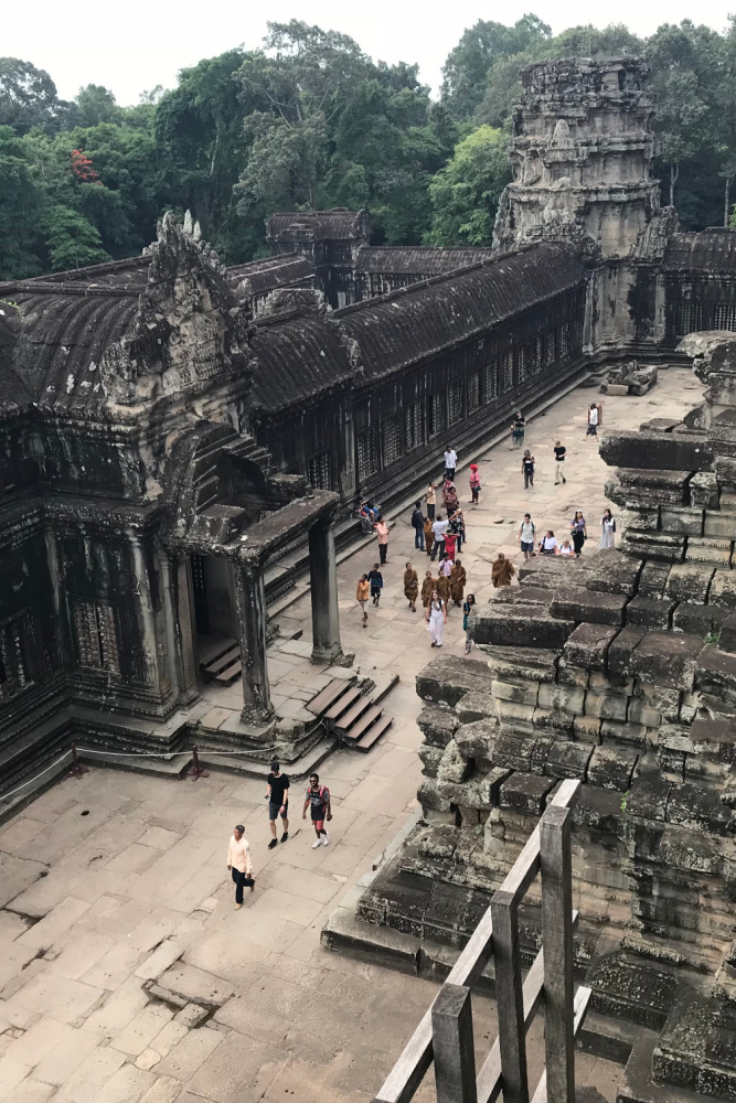 Aerial view of Angkor Wat and surrounding temple complex, showcasing its massive scale and layout