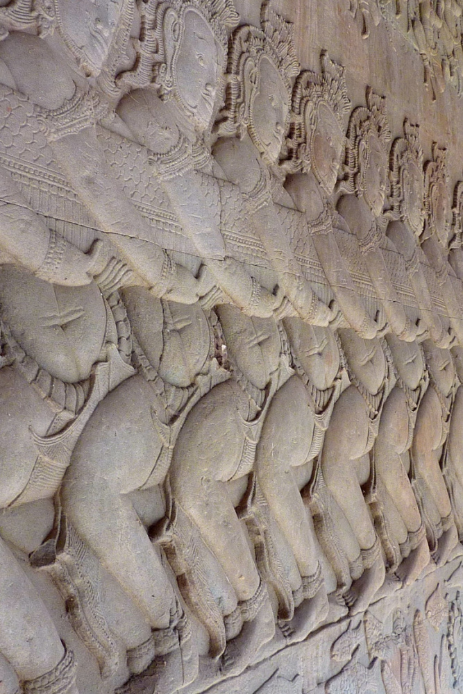 Intricate bas-relief depicting the Churning of the Ocean of Milk, a legendary Hindu myth, at Angkor Wat in Siem Reap