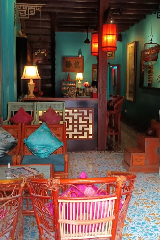 Miss Wong Cocktail Bar in Siem Reap, showcasing vibrant Asian-inspired decor and cozy seating