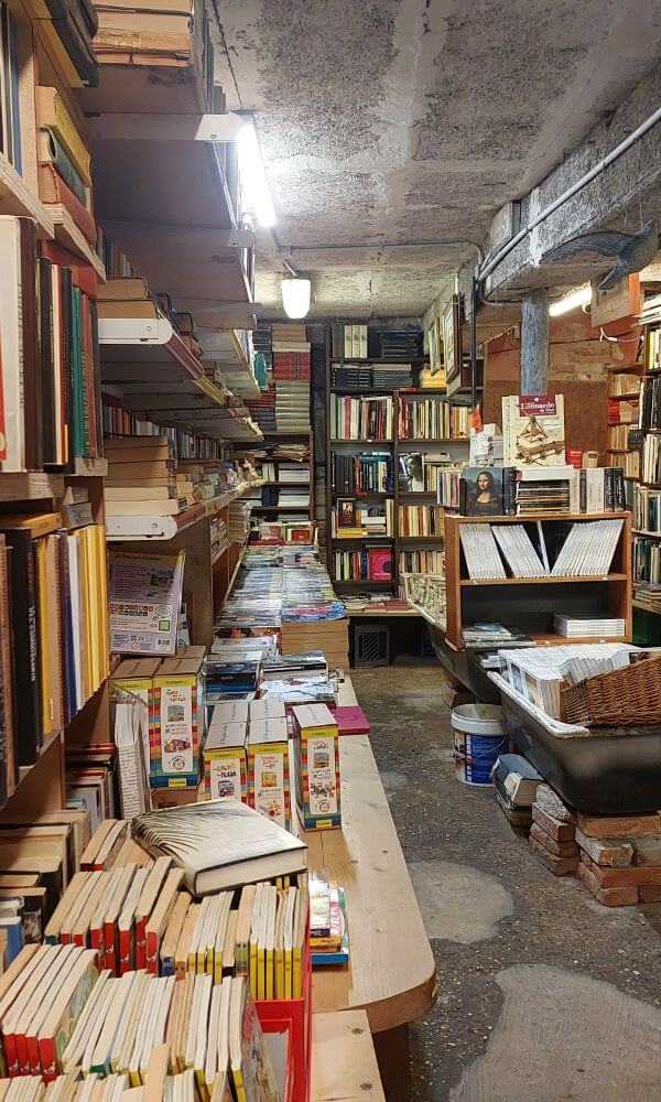 Quirky interior of Libreria Acqua Alta filled with used books and vintage charm