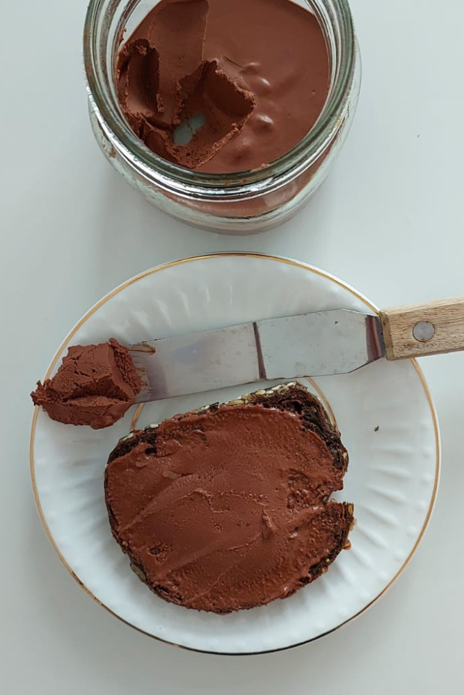 Homemade chocolate spread recipe in a glass jar, dairy-free cocoa spread.